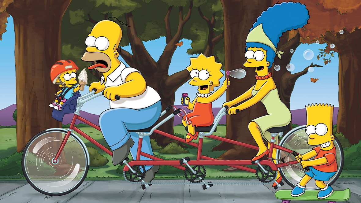 The Simpsons on a tandem bicycle. From left to right, Maggie is offering Homer an ice cream cone that he is trying to eat. Lisa is blowing bubbles, Marge is pedaling on the backseat, and Homer is riding a skateboard attached to the bicycle. 