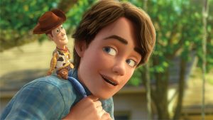 Andy and Woody from Toy Story 3 (2010). Andy has placed Woody on his shoulders and is looking back at him.