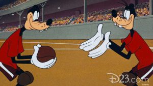 A still from the Disney animated short Double Dribble shows two of the Goofy look-alikes, with one holding a basketball, with the other Goofy requesting it.
