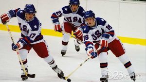 A stirring mid-action scene in the Disney film Miracle showcases three members of the 1980 Winter Olympics men’s hockey team on the ice with the puck in their possession.
