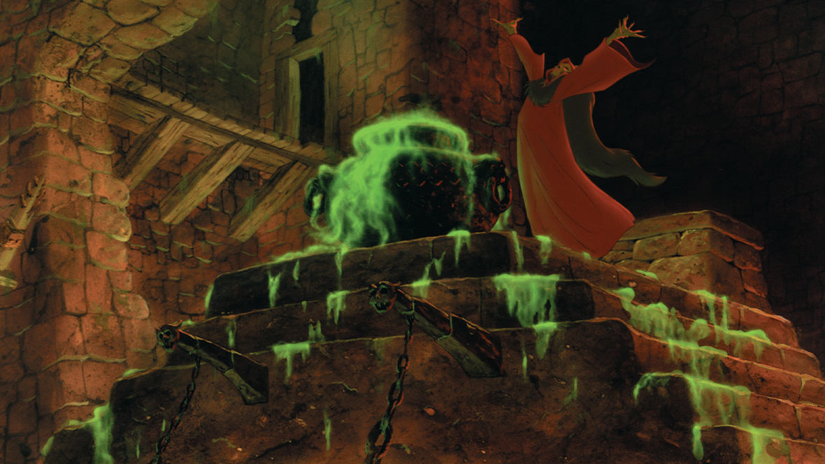 Horned King raising his arms above his head in front of a large cauldron overflowing with green liquid in The Black Cauldron