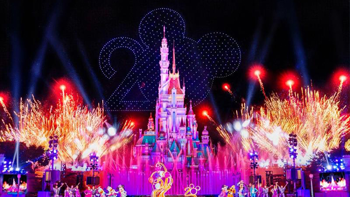 A nighttime spectacular show in front of the Castle of Magical Dreams at Hong Kong Disneyland, celebrating the resort’s 20th anniversary, as part of “The Most Magical Party of All.” Fireworks are seen shooting off from all around the castle’s exterior.
