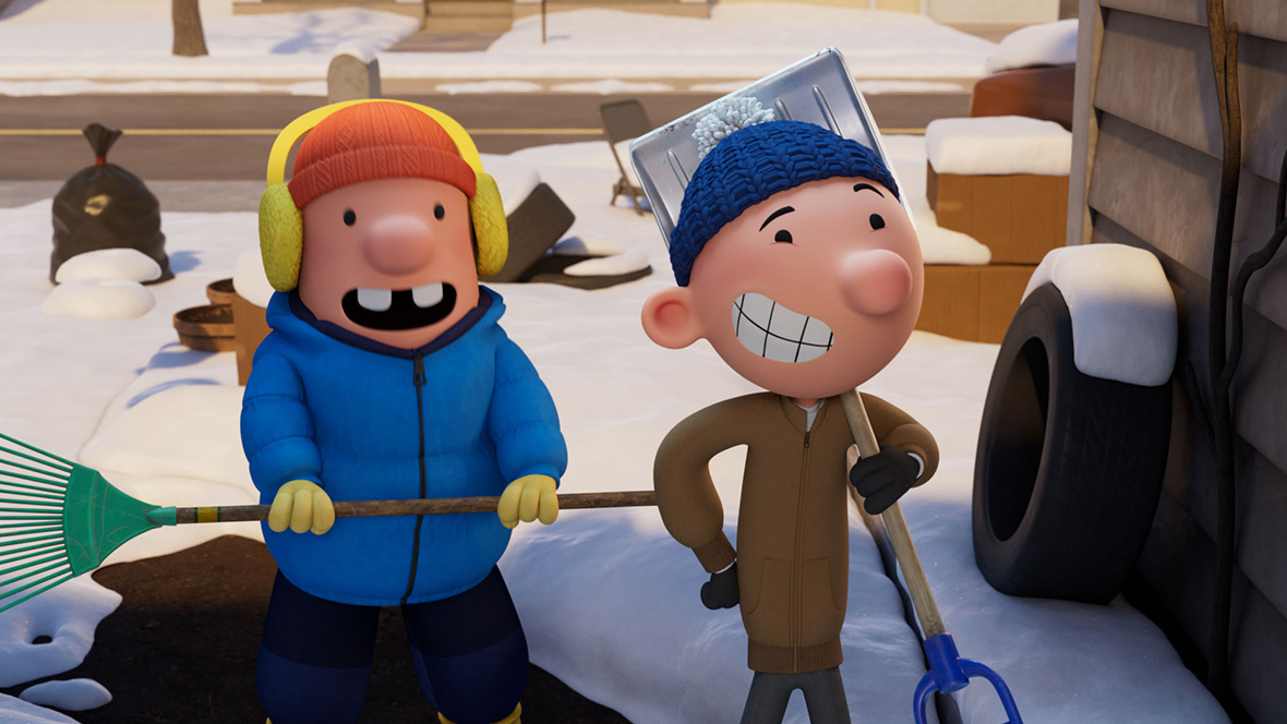 In a still frame from the animated film Diary of a Wimpy Kid: The Last Straw, two boys stand on a snowy sidewalk outside a house. The boy on the left wears a puffy blue winter coat, yellow earmuffs and gloves, and an orange knit cap, and he’s holding a green rake. The boy on the right is thinner, wearing a brown winter jacket, blue knit cap, and dark gloves. The boy on the right is smiling, while the boy on the left has his mouth open as if he 