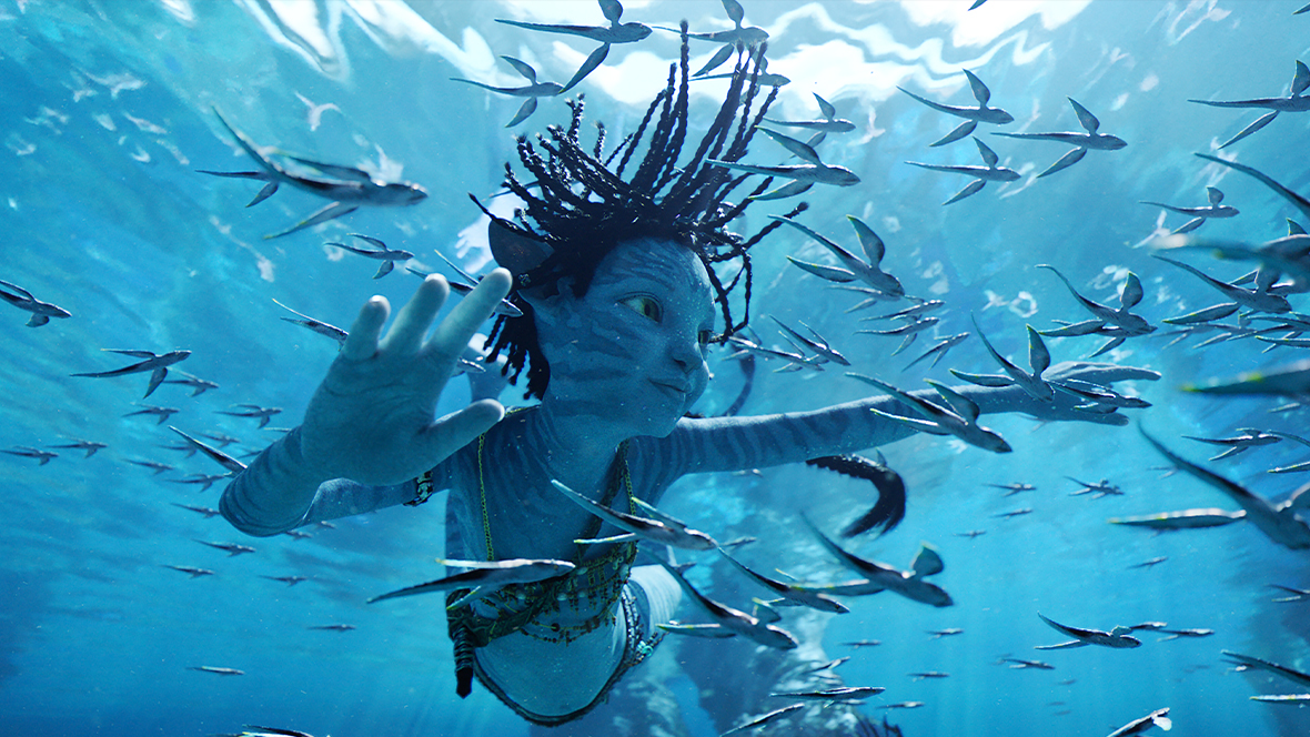 Tuk (Trinity Jo-Li Bliss) swims amongst various sea creatures.