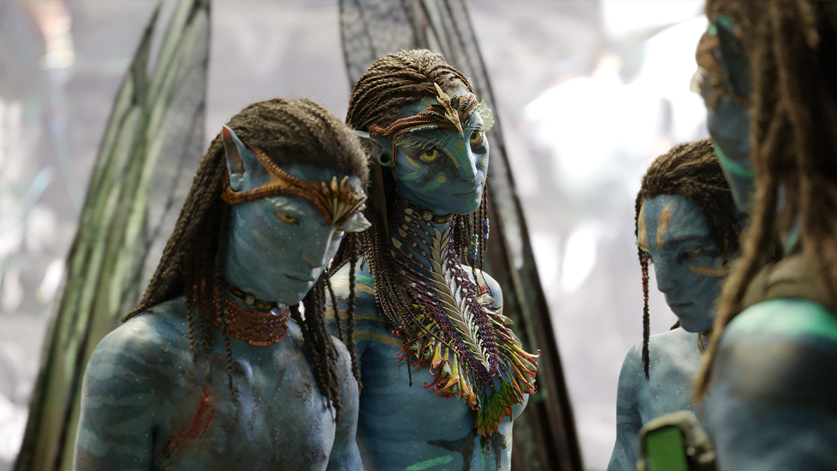 From left to right, Neteyam (Jamie Flatters), Neytiri (Zoe Saldaña), Lo'ak (Britain Dalton), and Jake Sully (Sam Worthington) have a tense family meeting.