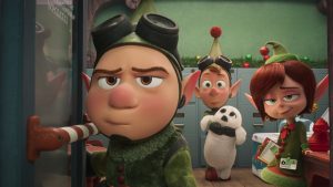 Wayne (voiced by Dave Foley), Lanny (voiced by Derek Richardson), and Magee (voiced by Sarah Chalke) in a still from Prep & Landing: The Snowball Protocol. The elves all appear in an office at the North Pole, and Lanny is holding a white baby seal.