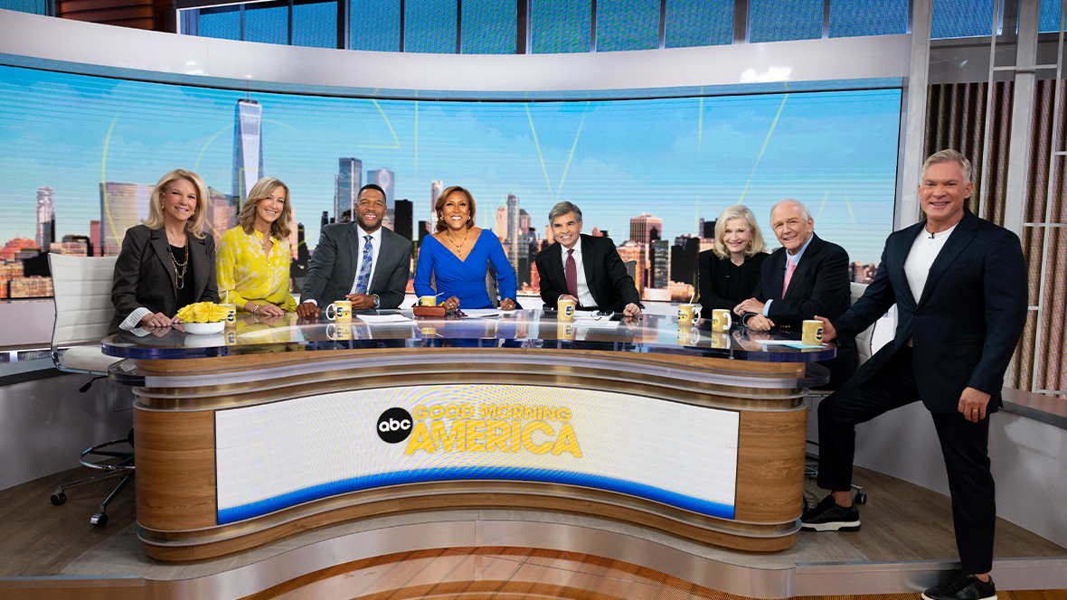 From left to right, Joan Lunden, Lara Spencer, Michael Strahan, Disney Legend Robin Roberts, George Stephanopoulos, Disney Legend Diane Sawyer, Charlie Gibson, and Sam Champion pose for a photo during the 50th anniversary episode of ABC News' Good Morning America.