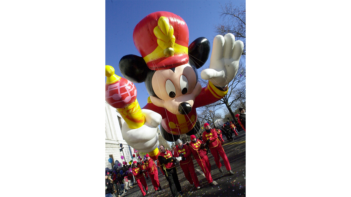 A historical image of the bandleader Mickey Mouse balloon from the 2000 Macy’s Thanksgiving Day Parade. Mickey’s outfit evokes the same one he’d wear on the 1950s classic Mickey Mouse Club television series.