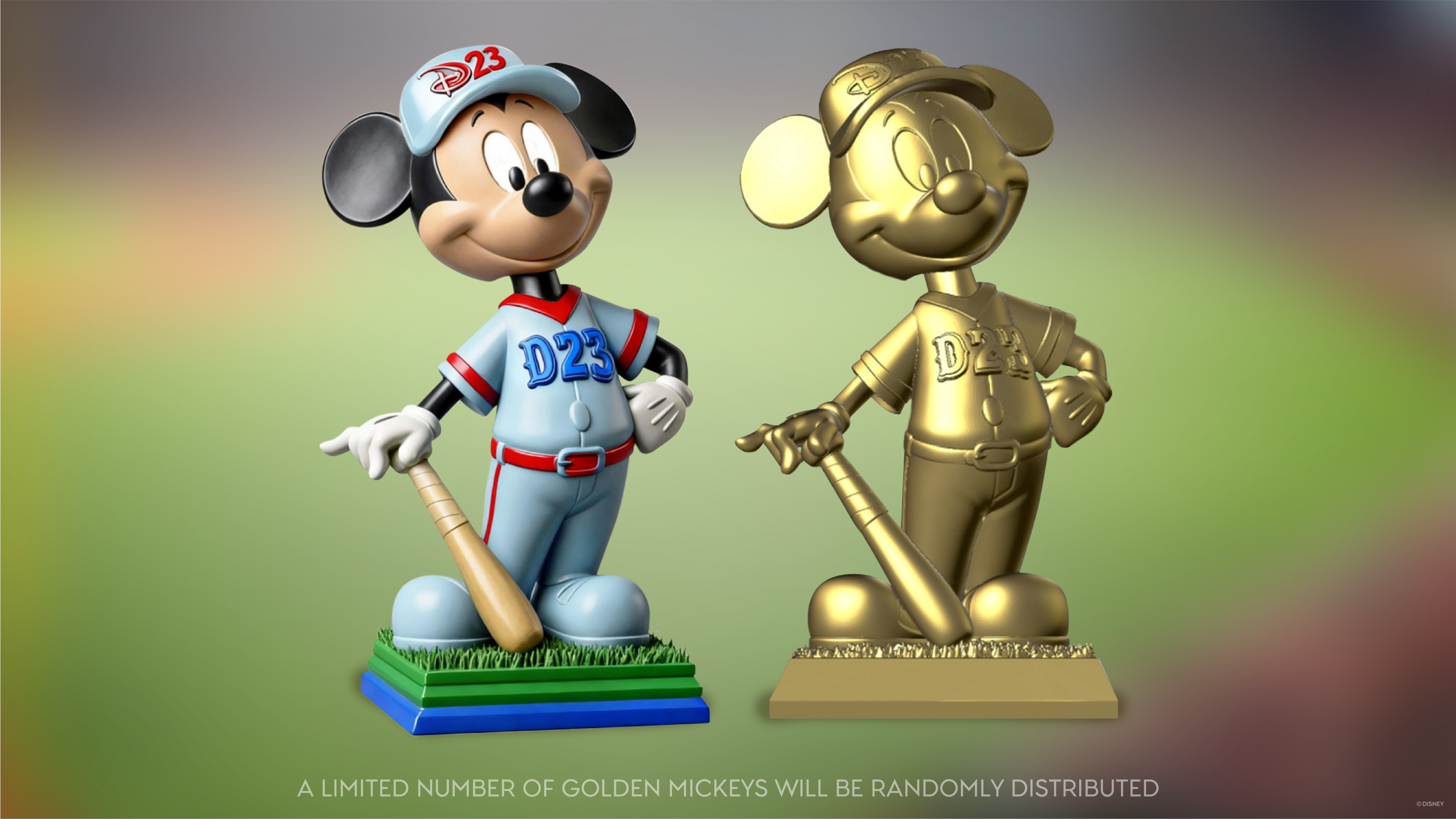 Two collectible Mickey Mouse baseball figurines side by side&mdash;one in full color wearing a D23 baseball uniform and holding a bat, and the other a gold variant of the same figure&mdash;set against a soft, blurred green background with text noting that a limited number of golden Mickeys will be randomly distributed.