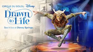 An acrobat dressed as an owl leaps into the air in front of a background of a theater stage. The logo for Drawn to Life presented by Cirque du Soleil and Disney is seen on the left of the image, atop a pencil drawing of the seating area of a theater; the words &ldquo;See it live at Disney Springs&rdquo; are written the logo.