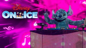 A performer dressed as Stitch is DJ-ing on a podium with one of his hands in the air. The other hand is at a laptop. Behind Stitch is a pink & black LED-style background, complete with flashing pink lights and music notes. At the top left of the graphic rests the Disney On Ice logo.