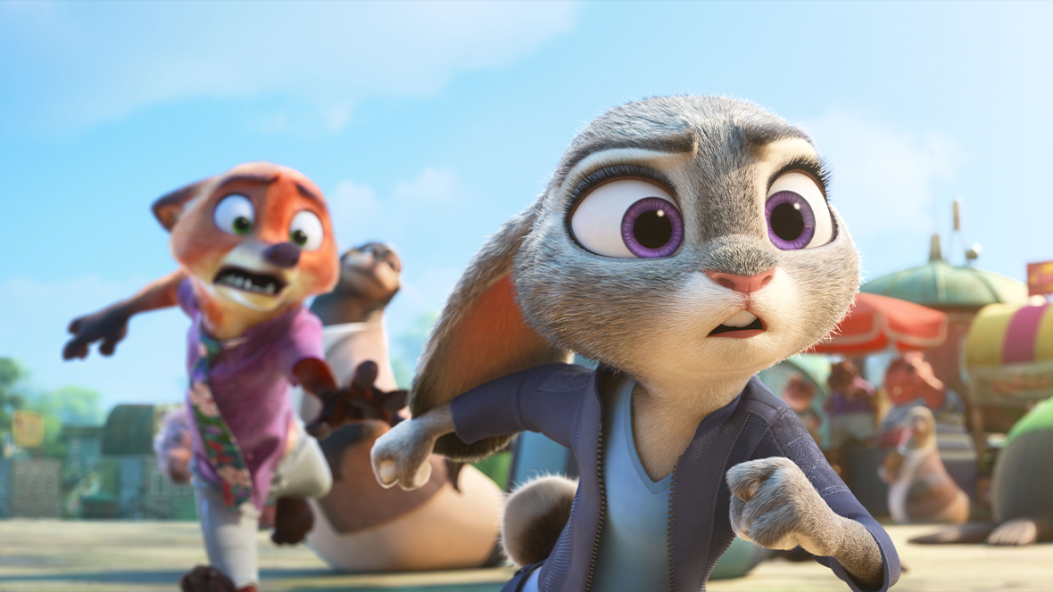 A still from Walt Disney Animation Studios’ Zootopia 2 features Judy Hopps (voiced by Ginnifer Goodwin) running at something off screen to the right. Behind her is Nick Wilde (voiced by Jason Bateman); he’s trying to grab at her arm.