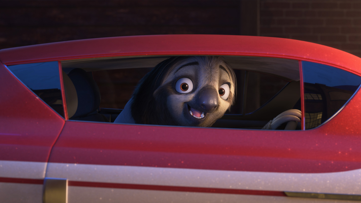 A still from Walt Disney Animation Studios’ Zootopia 2 features Flash; he’s behind the wheel of a car and smiling widely.