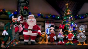 In an image from one of the three new Mickey & Minnie’s Holiday Songs stop-motion shorts, Goofy (left) is high-fiving Santa (middle) while Pluto, Mickey Mouse, Minnie Mouse, Daisy Duck, and Donald Duck (right) look on. They are all standing in a cabin with a fireplace and a lit Christmas tree; stockings hang from the fireplace’s mantel.