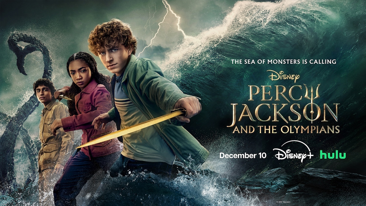 Key art for Season 2 of Percy Jackson and the Olympians on Disney+. On the left of the image are (from left to right) Aryan Simhadri as Grover, Leah Sava Jeffries as Annabeth, and Walker Scobell as Percy; Annabeth is holding a dagger and Percy is holding a sword, and all three are looking intently at the camera. On the right side of the image is the logo for the series as well as the logos for Disney+ and Hulu and the premiere date, December 10. The background denotes a roiling sea.