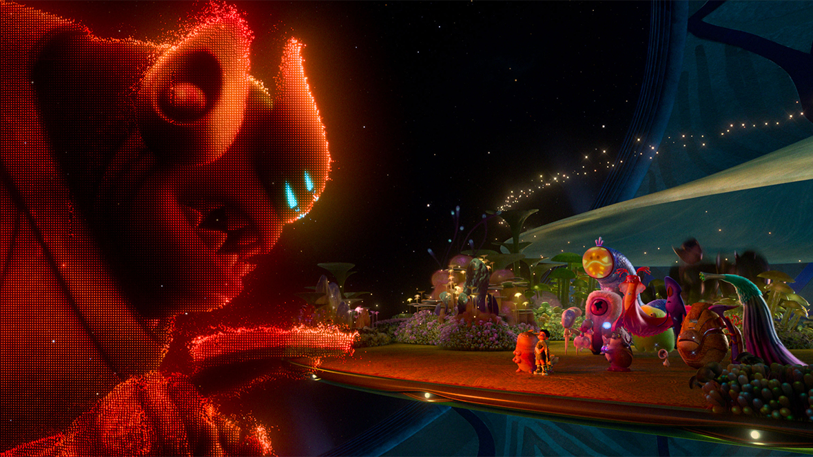 The alien Lord Grigon appears as a giant, glowing, pixelated red hologram. He towers over Elio and a small group of aliens. Elio and the other aliens stand on a floating platform, looking up at the projection in awe. The background is a dark, celestial void filled with distant sparkling lights and soft purple structures.