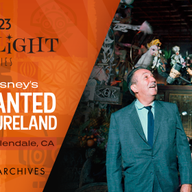 Promotional graphic for the D23 Spotlight Series &ldquo;Walt Disney&rsquo;s Enchanted Adventureland.&rdquo; The left side features an orange-patterned background with event details, including the date (&ldquo;Mar 28&rdquo;) and location (&ldquo;Glendale, CA)&rdquo;)&mdash;along with the Walt Disney Archives logo. The right side shows a vintage photograph of Walt Disney inside the Enchanted Tiki Room, with colorful animatronic birds perched on decorative fixtures above his head, and guests observing the scene in the background.