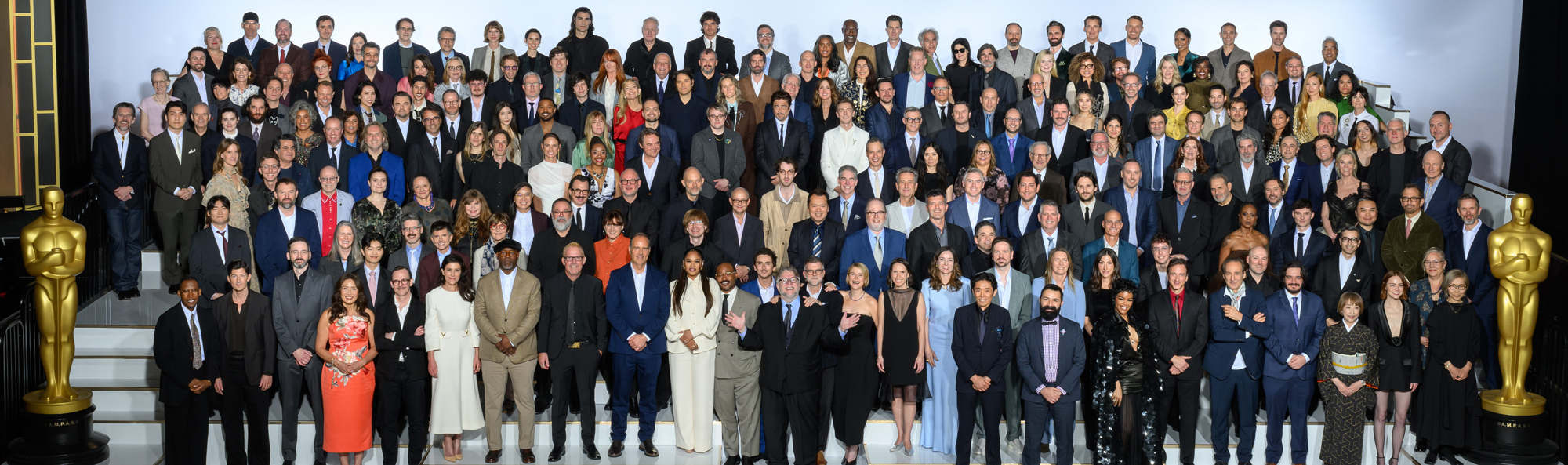 Dozens of Oscar nominees gather for a group photo during a luncheon.