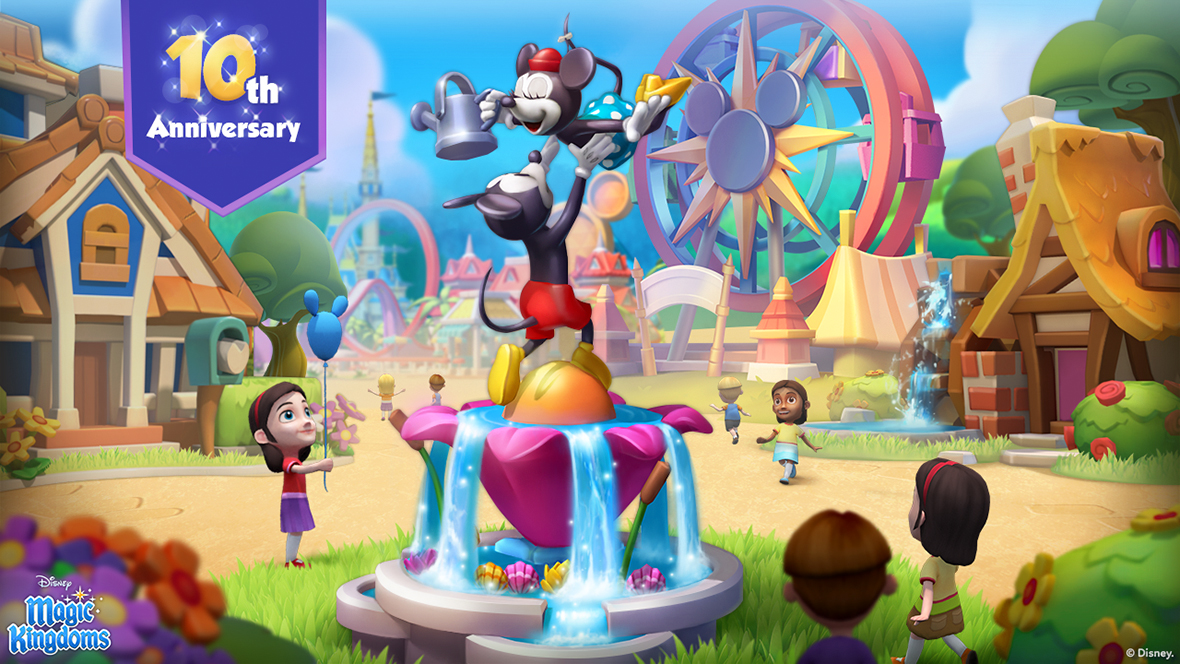 Promotional image for Disney Magic Kingdoms celebrating the game&rsquo;s 10th anniversary. Mickey Mouse stands on a colorful fountain statue lifting Minnie Mouse as she holds a watering can, with water flowing from the fountain below. Children watch and play around them in a bright theme park setting with attractions, including a large Ferris wheel, in the background. A purple banner in the corner reads &ldquo;10th Anniversary.&rdquo;