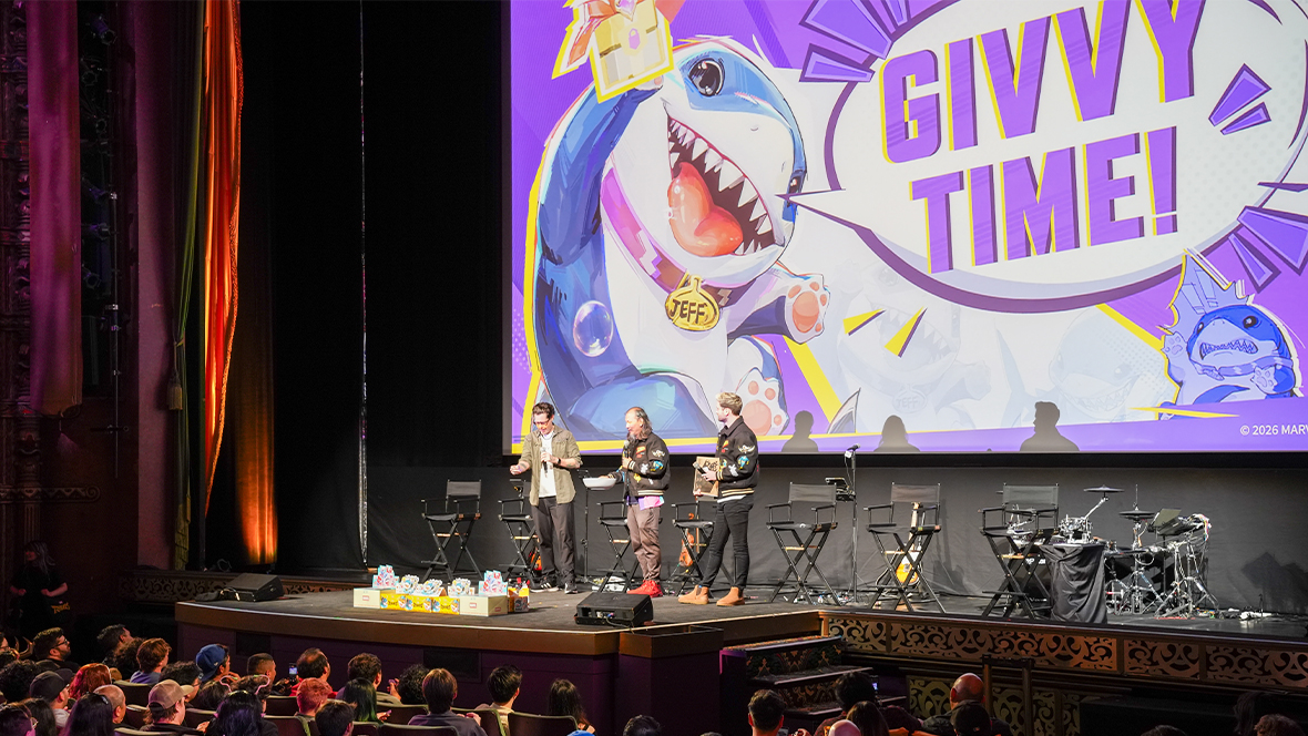 An image from the recent Marvel Rivals Assemble event at the El Capitan Theatre in Hollywood, CA, announcing the upcoming &ldquo;Path to Doomsday&rdquo;; Marvel Games executive producer Danny Koo, center, is flanked by two other people on stage; a large image of Jeff the Land Shark is on the screen behind them.
