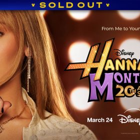A promotional graphic for the Hannah Montana 20th Anniversary Special featuring a close-up of Miley Cyrus. The background is filled with large, glowing circular lights. To the right, the logo reads &ldquo;Disney Hannah Montana 20th Anniversary Special&rdquo; in gold and purple stylized lettering. Additional text reads &ldquo;From Me to Younger You&rdquo; above the logo, and below, &ldquo;March 24&rdquo; with the Disney+ and Hulu logos. A banner at the top reads SOLD OUT.