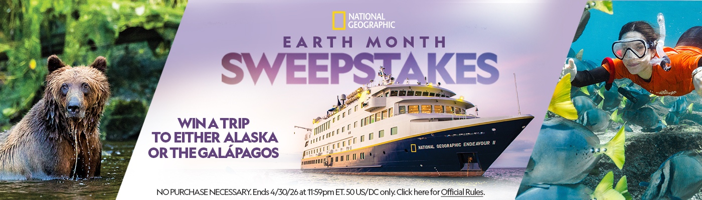 National Geographic Earth Month Sweepstakes graphic shows a bear, cruise ship, and snorkeler with text &ldquo;Win a trip to either Alaska or the Gal&aacute;pagos.&rdquo;