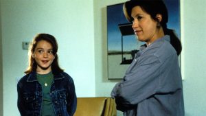 In an image from 1998&rsquo;s The Parent Trap, &ldquo;Hallie&rdquo; (Lindsay Lohan), left, and Chessy (Lisa Ann Walter), right, stand next to each other and look at something off camera to the left.