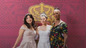 Three attendees at The Princess Diaries 25th Anniversary Pop-Up Experience Photo-booth.