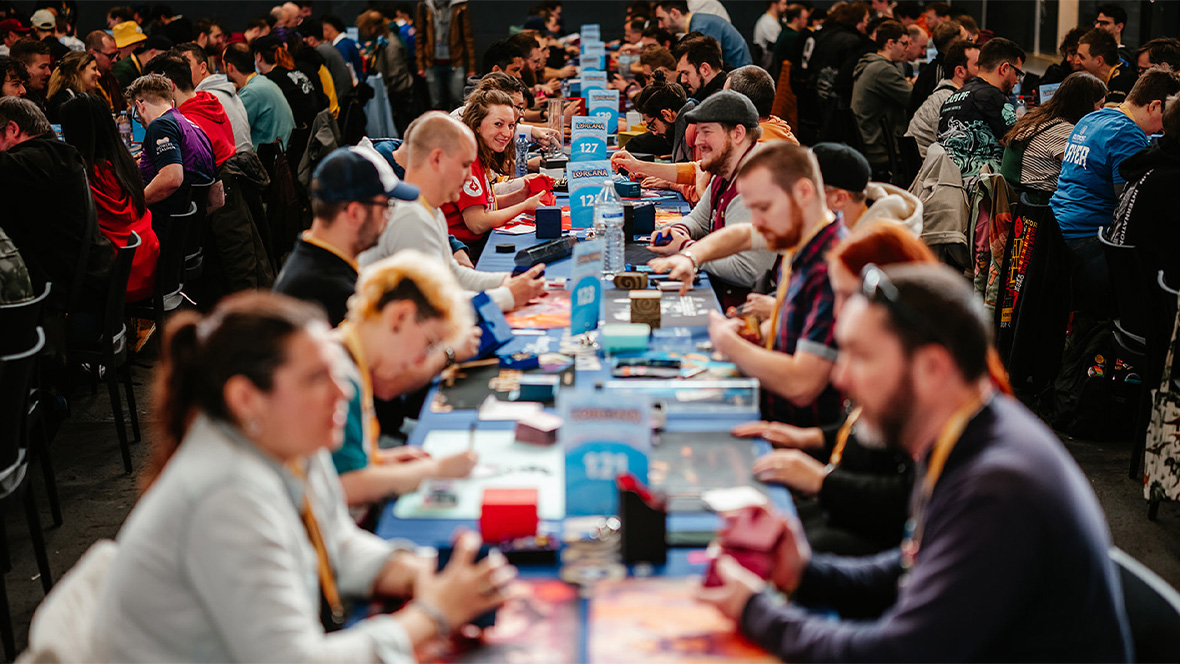 A group of people playing Lorcana.