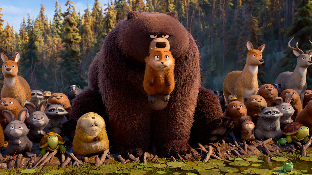 In a still image from Disney and Pixar&rsquo;s Hoppers, Mabel Beaver (voiced by Piper Curda) is being held up in the mouth of a bear, and is surrounded by many other animals.