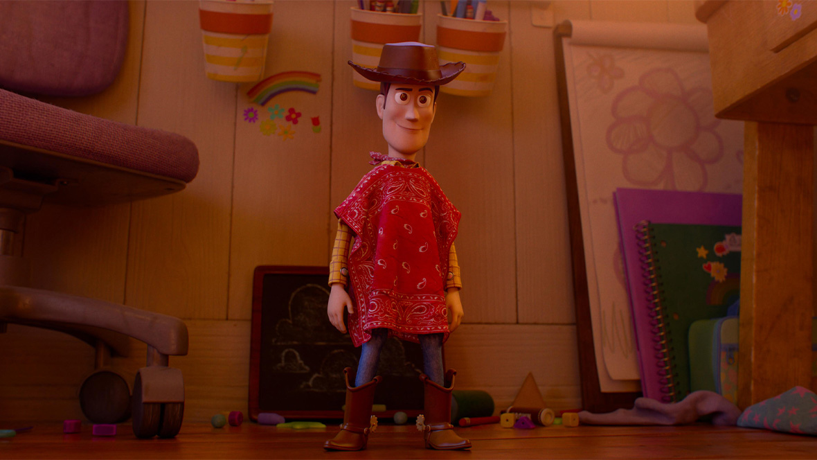 In an image from Disney and Pixar&rsquo;s Toy Story 5, Woody (voiced by Tom Hanks) is standing in Bonnie&rsquo;s room and wearing a red bandana-style poncho.