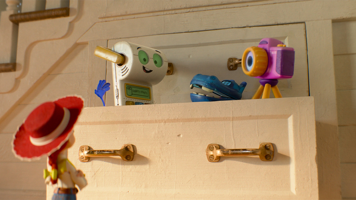 In an image from Disney and Pixar&rsquo;s Toy Story 5, Smarty Pants (voiced by Conan O&rsquo;Brien), left, Atlas (voiced by Craig Robinson), middle, and Snappy (voiced by Shelby Rabara), right, are peaking out of a drawer while Jessie (voiced by Joan Cusack) looks on from below.)