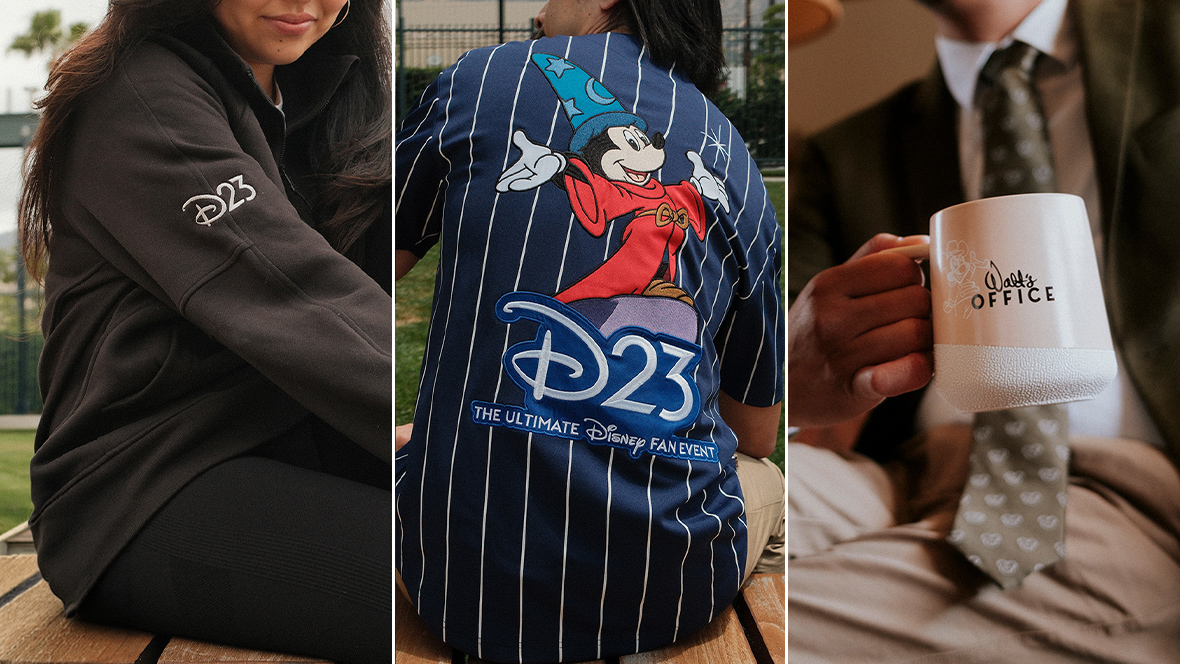 D23-branded merchandise includes a black jacket, Sorcerer Mickey jersey, and Walt&rsquo;s Office mug displayed in lifestyle settings.