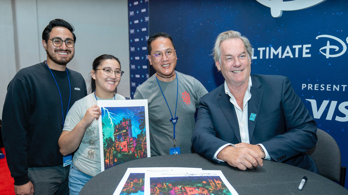 Disney artist and former Imagineer Eric Robison with three attendees.