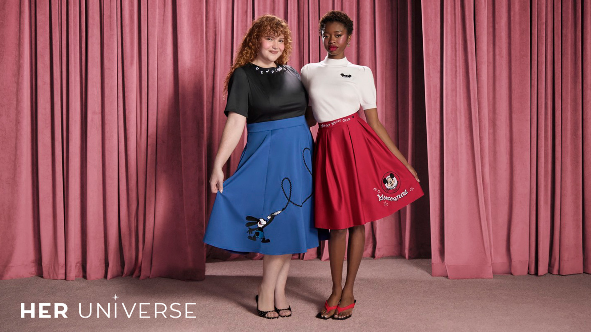 Two adults wearing outfits from Her Universe.