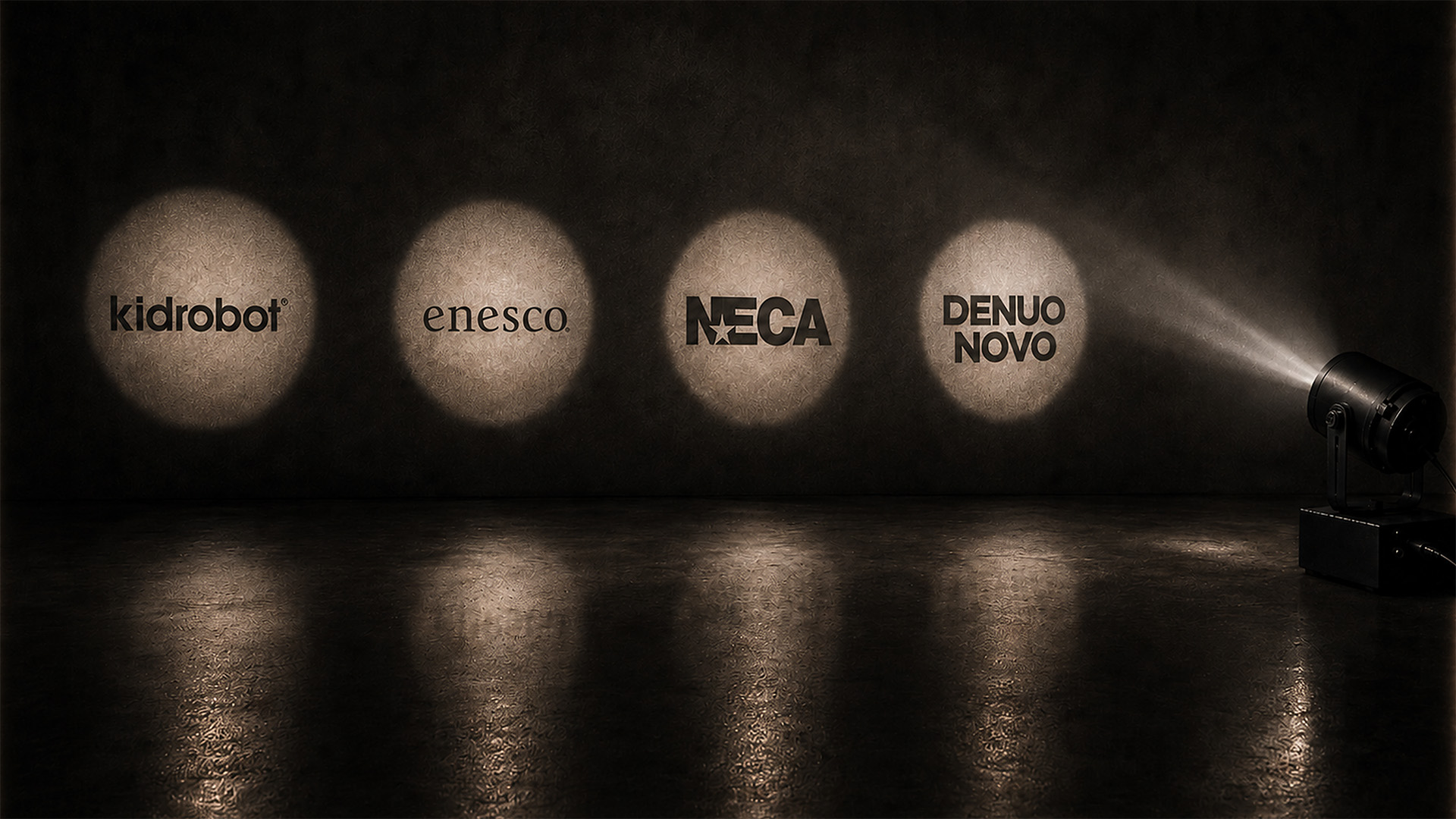 Several spotlights showcasing several different logos including kidrobot and NECA.