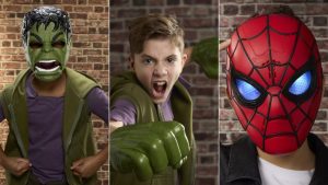 Side by side images of kids wearing a Hulk mask, Hulk Gamma Smash Fists, and a Spider-Man mask.