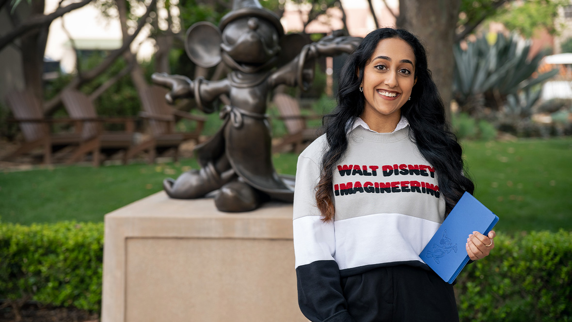 An image of a person wearing a Walt Disney Imagineering sweater, an item that will be available at Mickey’s of Glendale—one of the stores at D23: The Ultimate Disney Fan Event 2026.