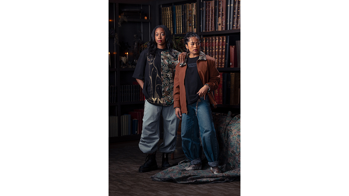An image of two people wearing clothing from the Disney .YNSD collection, which can be found during D23: The Ultimate Disney Fan Event 2026.