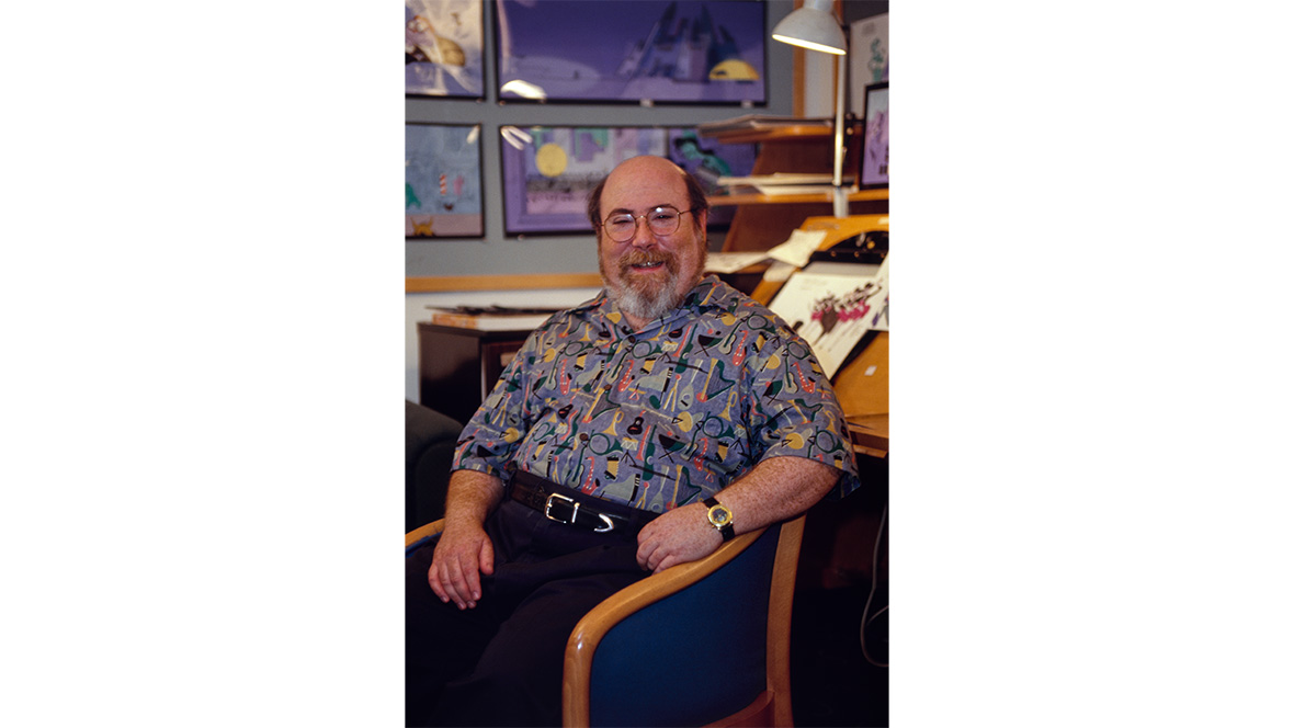 Disney Legend Eric Goldberg poses in front of his desk at Walt Disney Animation Studios.