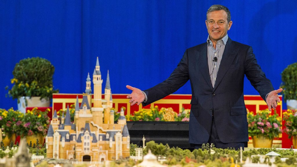 Bob Iger presents a scale model of Shanghai Disney Resort during a media event announcing the destination.
