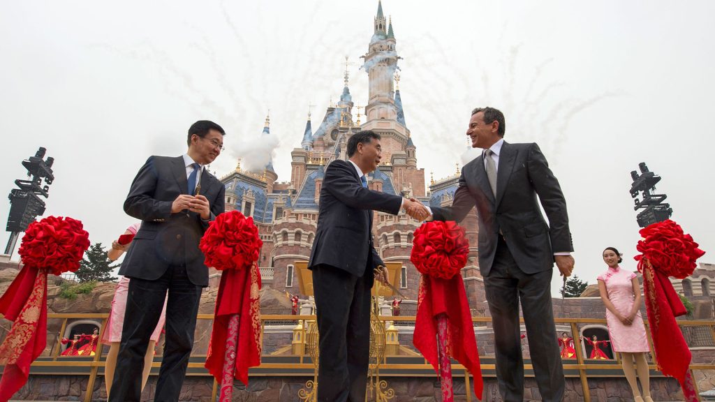 Bob Iger participates in a ceremonial ribbon-cutting moment in front of Enchanted Storybook Castle during the Shanghai Disney Resort opening celebration.