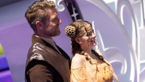 Two D23 attendees cosplaying as Anakin Skywalker and Padm&eacute; Amidala from Star Wars pose together at D23: The Ultimate Disney Fan Event.