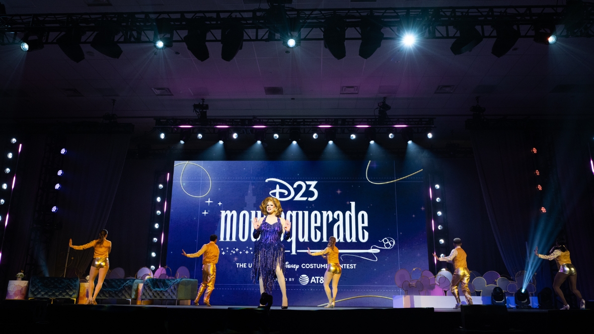 An image of Nina West&rsquo;s opening number from the D23 2026 Mousequerade costume contest at D23: The Ultimate Disney Fan Event.