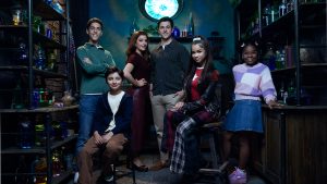 A promotional image for Disney&rsquo;s Wizards Beyond Waverly Place, featuring (from left to right) costars Alkaio Thiele, Max Matenko, Mimi Gianopulos, David Henrie, Janice LeAnn Brown, and Taylor Cora.