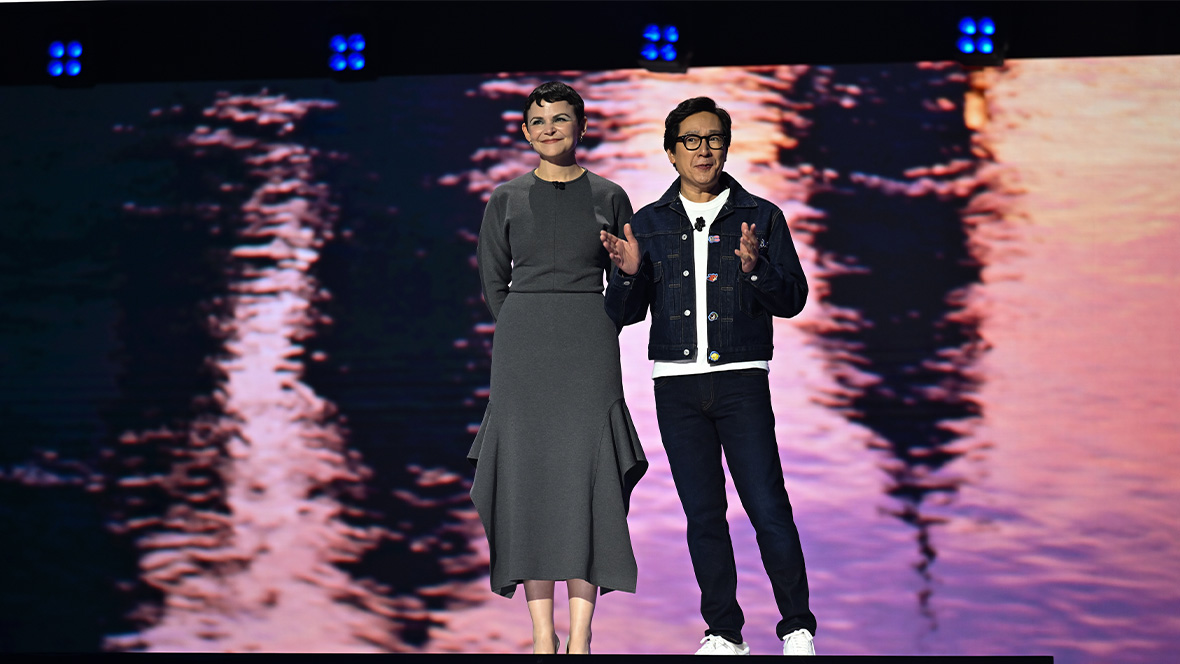 An image of Ginnifer Goodwin and Ke Huy Quan on stage at the Honda Center during the Disney Entertainment Showcase at D23: The Ultimate Disney Fan Event 2026.