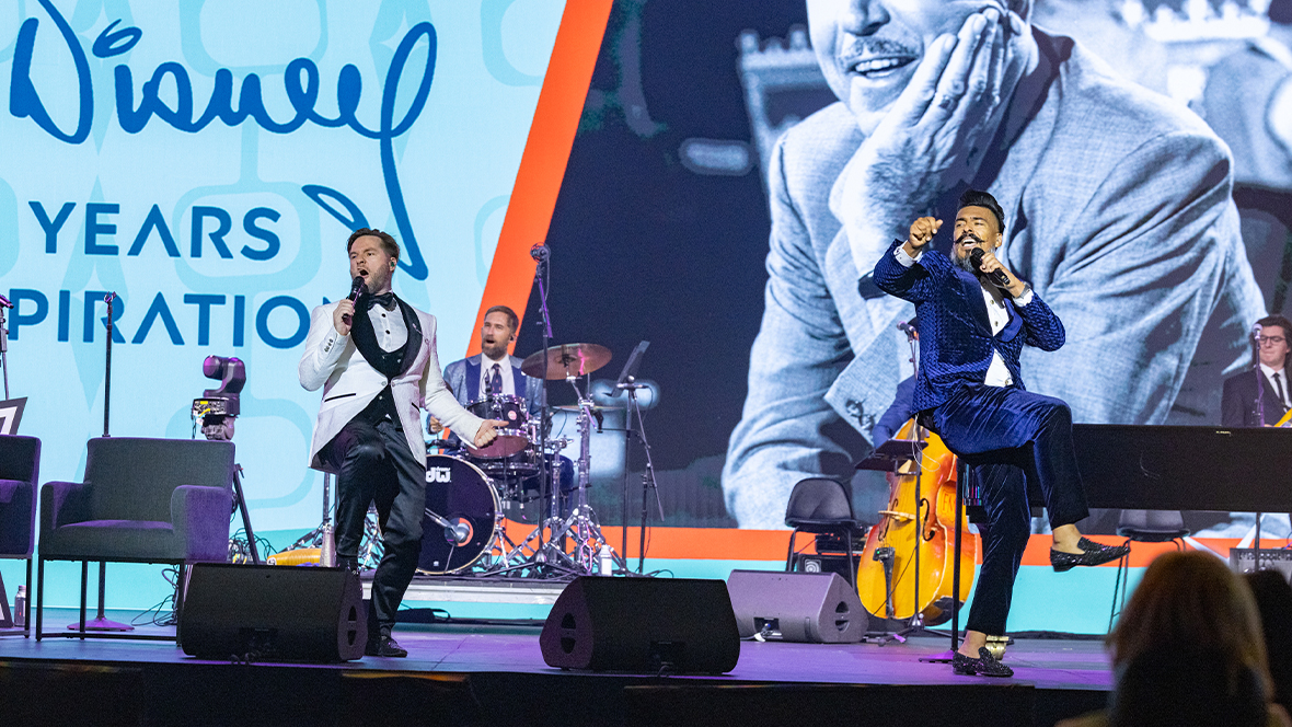 An image of Phat Cat Swinger performing during the &ldquo;Walt Disney: 125 Years of Inspiration&rdquo; panel at D23: The Ultimate Disney Fan Event 2026.