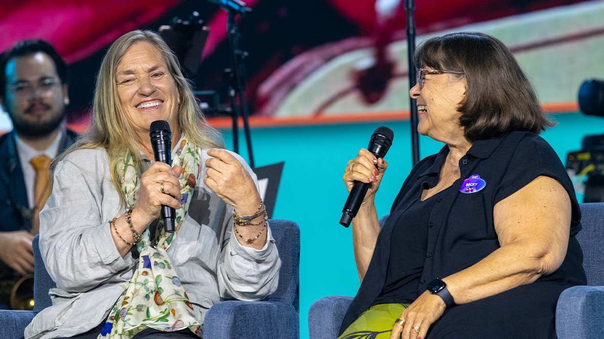 An image of Joanna Miller and director of the Walt Disney Archives Becky Cline, chatting during the &ldquo;Walt Disney: 125 Years of Inspiration&rdquo; panel at D23: The Ultimate Disney Fan Event 2026.