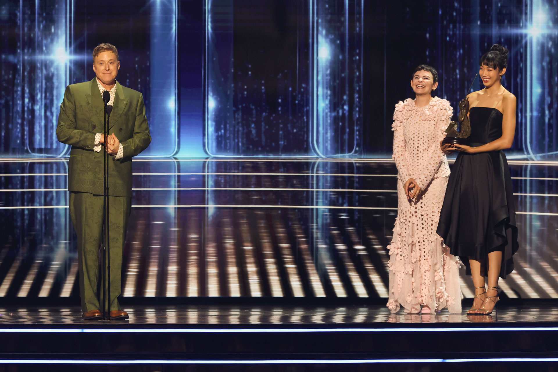 Alan Tudyk stands with Disney Legends honorees as they accept recognition during the 2026 Disney Legends Awards ceremony.