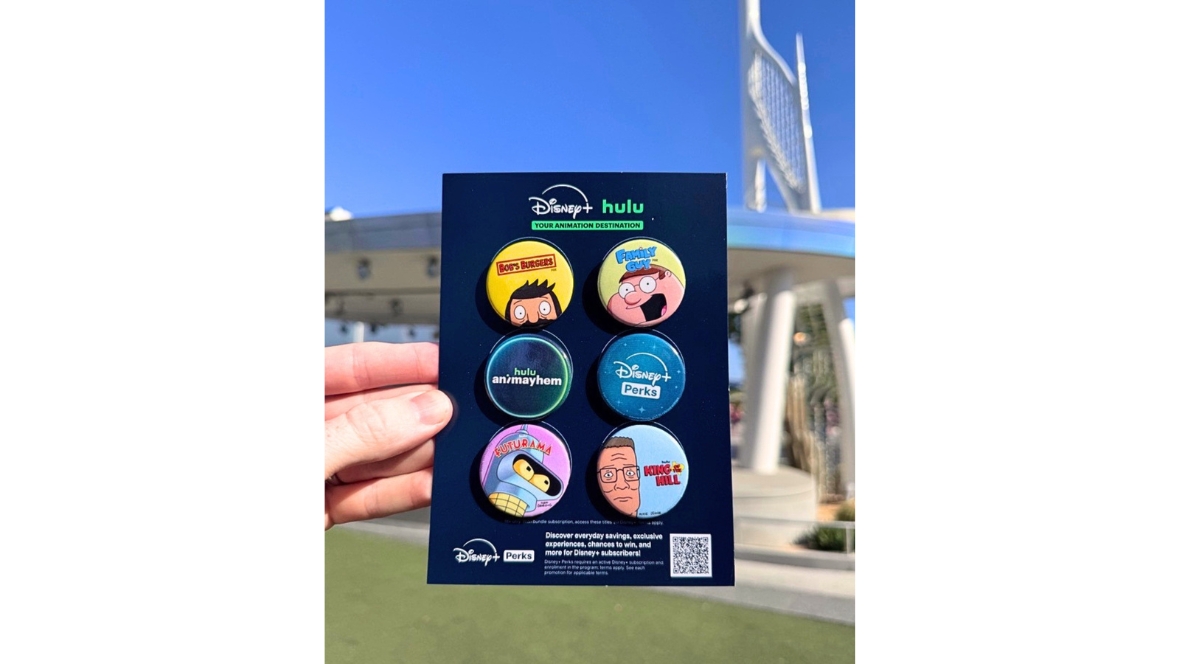 An image of buttons guests can receive at participating Downtown Disney locations during the Hulu Animayhem event, August 3 through 31. The buttons include logos for Bob&rsquo;s Burgers, Family Guy, Futurama, and King of the Hill, as well as for Hulu Animayhem and Disney+ Perks.